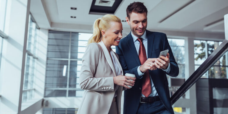 Business security male female looking at phone 01
