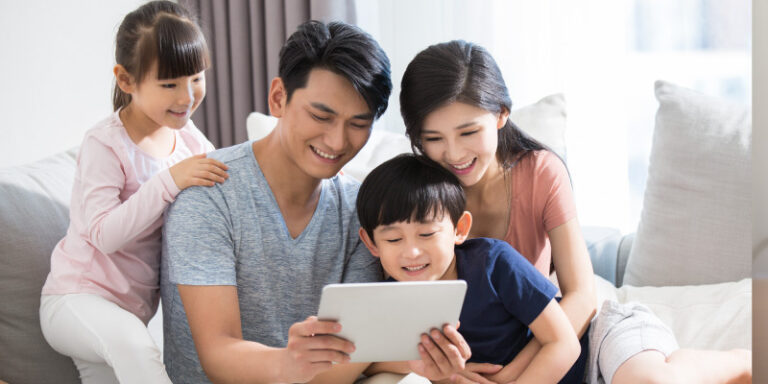 Boost your connectivity at and t family looking at tablet 01