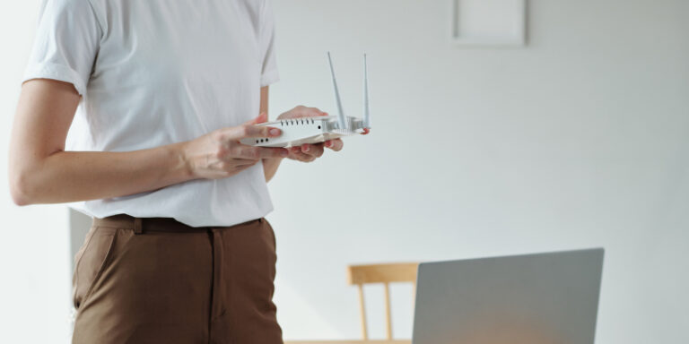 Slow internet connection female holding router 01