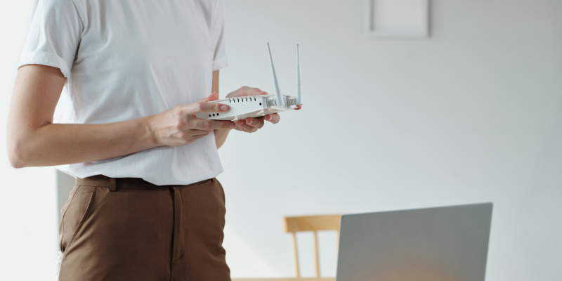 Slow internet connection female holding router 01