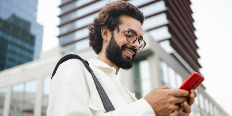 Cox app male looking at phone 01