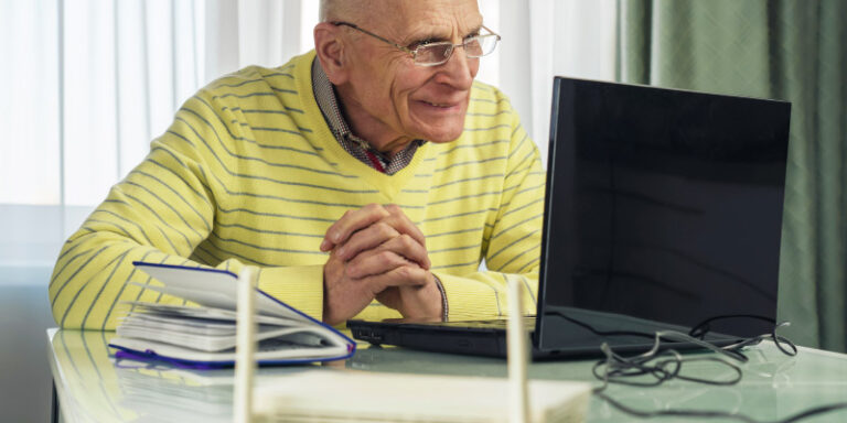 Viasat vs hughesnet senior using laptop 01