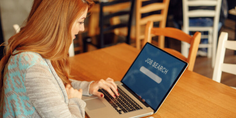 Finding your dream job online female using latop 01