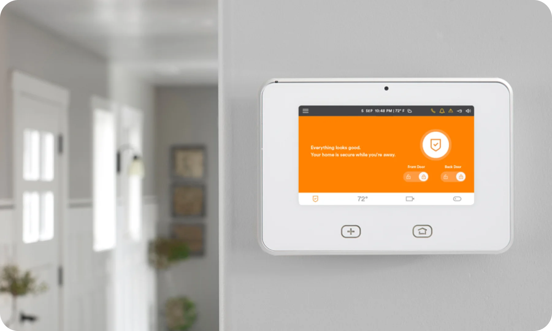 A smart light switch on a wall in a house.